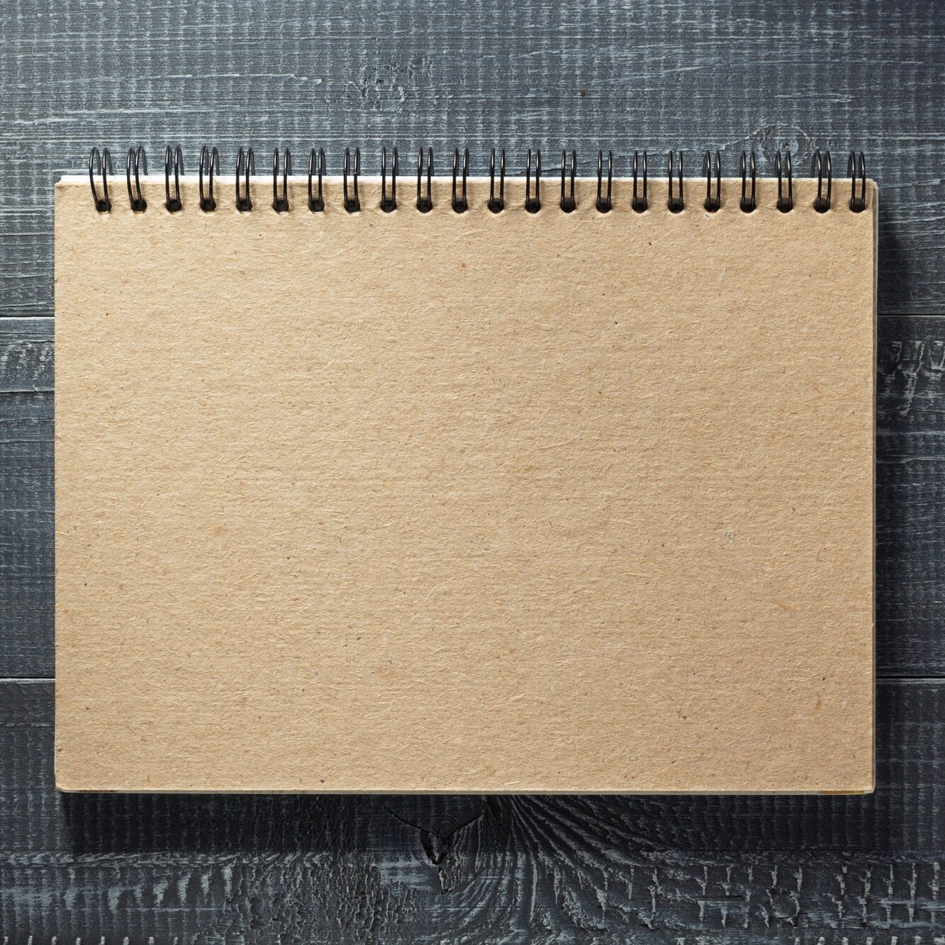 notebook at wooden background